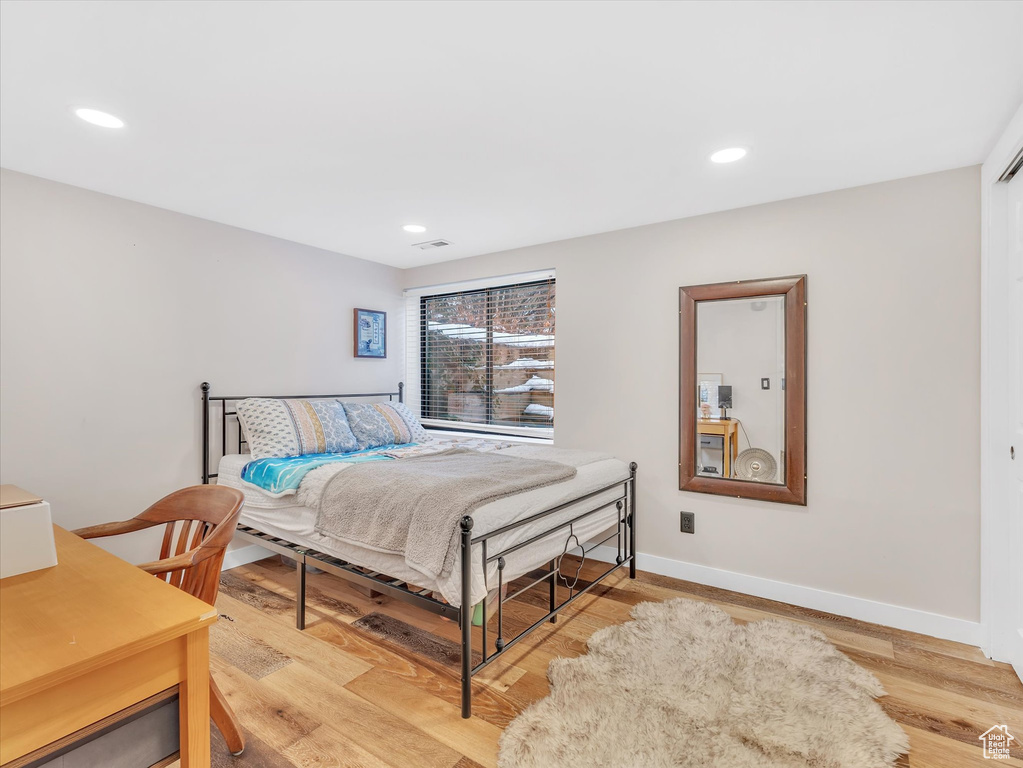 Bedroom featuring light wood-style flooring, recessed lighting, and baseboards