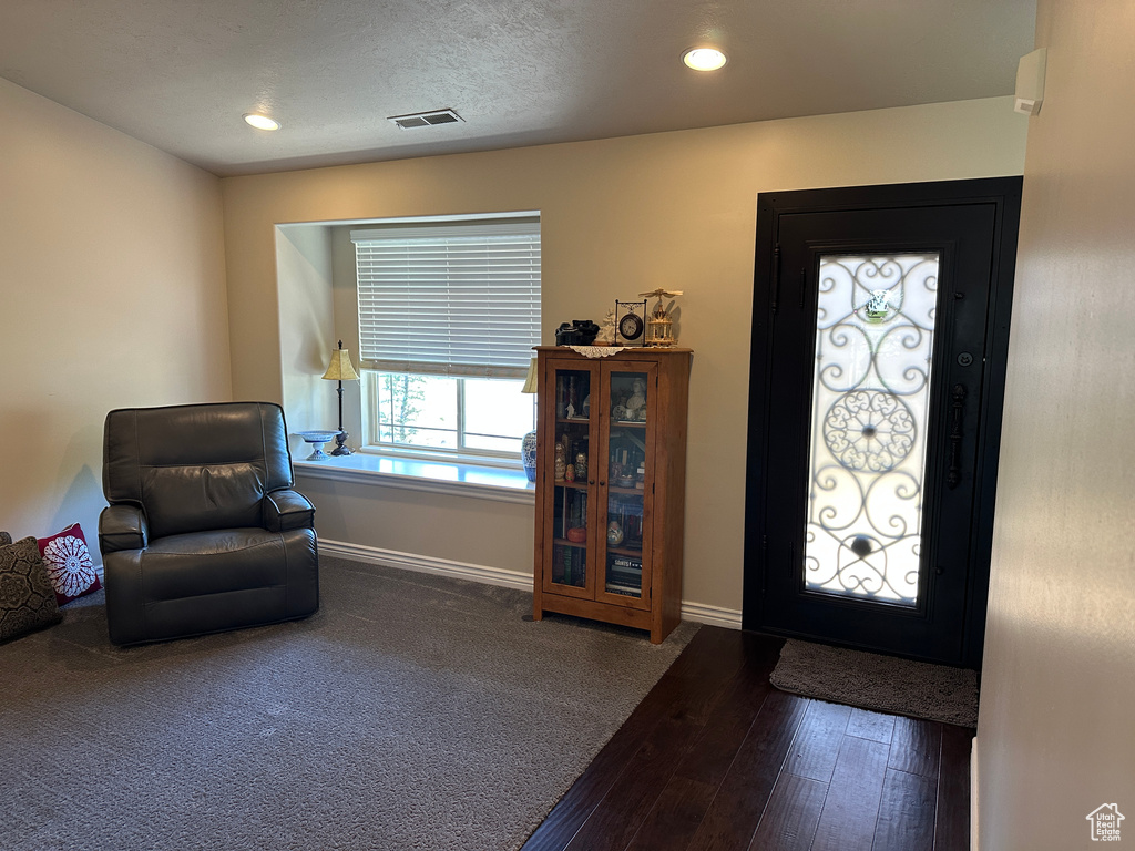 Foyer entrance with hardwood / wood-style floors, baseboards, and recessed lighting