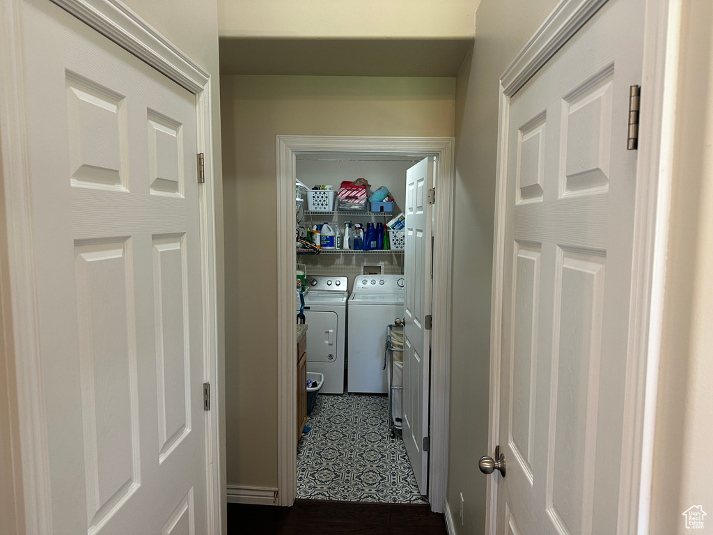 Washroom with washer and clothes dryer