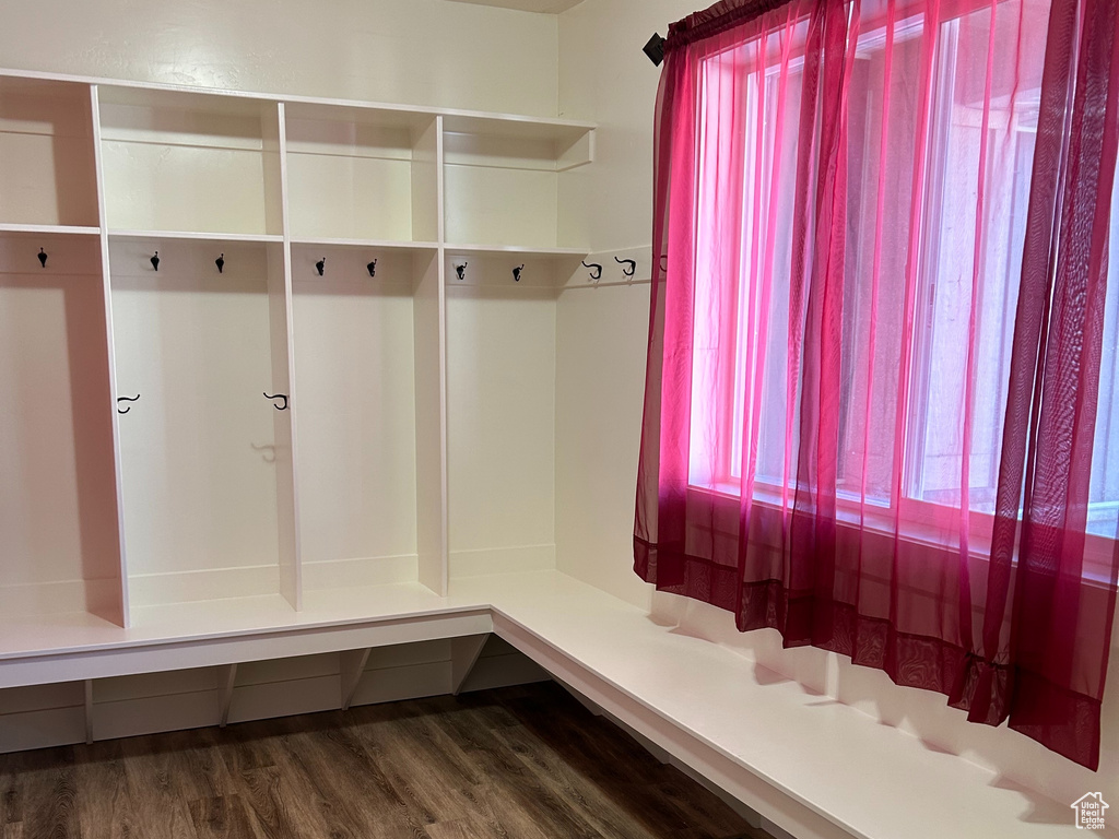 Mudroom featuring visible vents, a textured ceiling, and wood finished floors