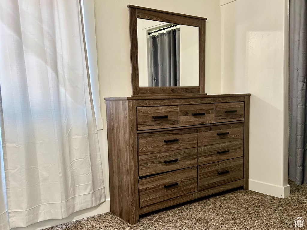 Unfurnished bedroom with carpet floors