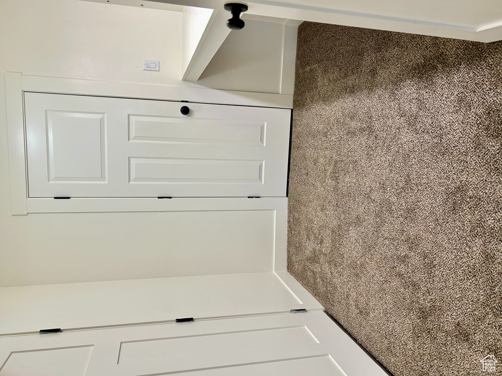 Unfurnished bedroom featuring baseboards and carpet floors