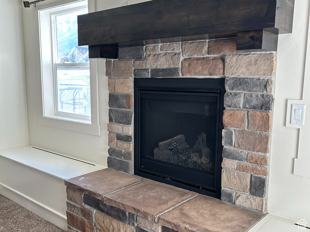 Room details featuring a textured ceiling and a fireplace