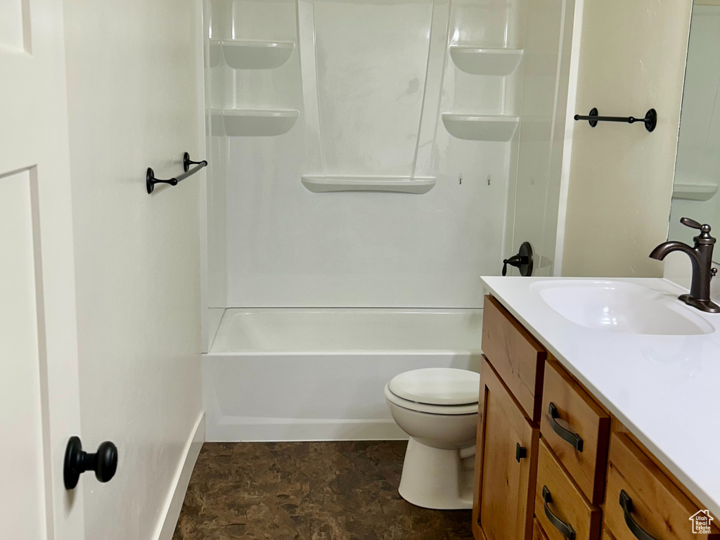 Bathroom with visible vents, shower / washtub combination, toilet, vanity, and a textured ceiling