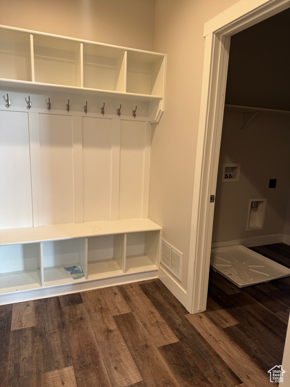Mudroom featuring visible vents, dark wood-type flooring, and baseboards