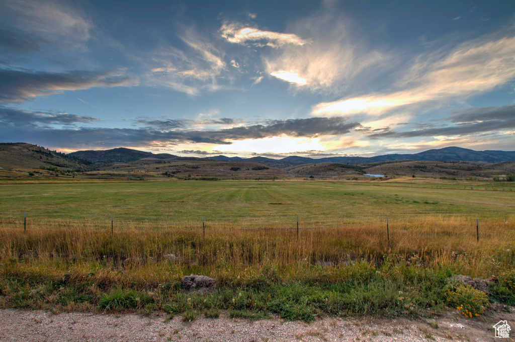 Property view of mountains with a rural view