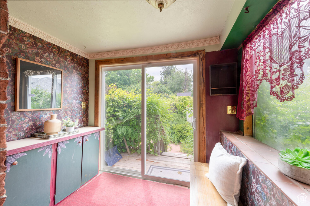 Doorway with wallpapered walls