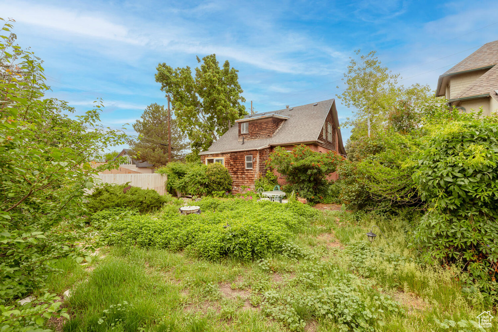 View of yard featuring fence