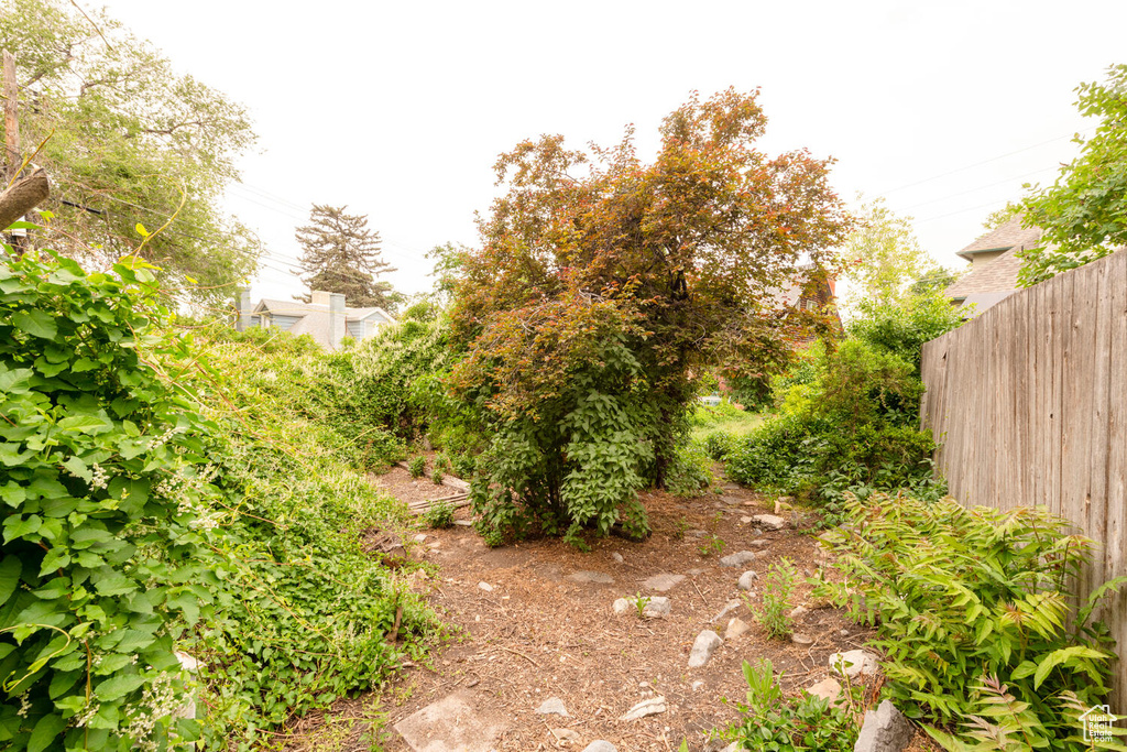 View of yard featuring fence