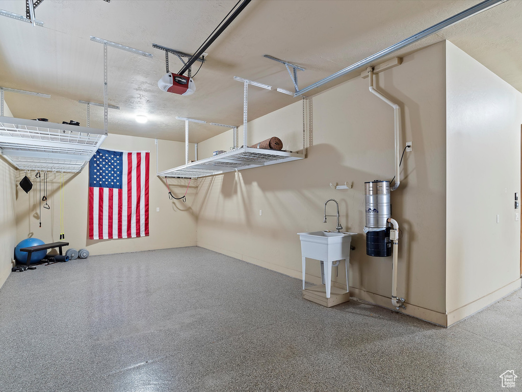 Garage featuring a garage door opener