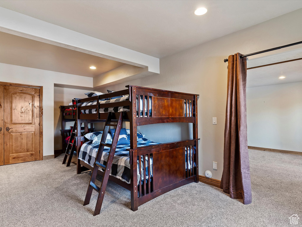 Carpeted bedroom featuring recessed lighting and baseboards