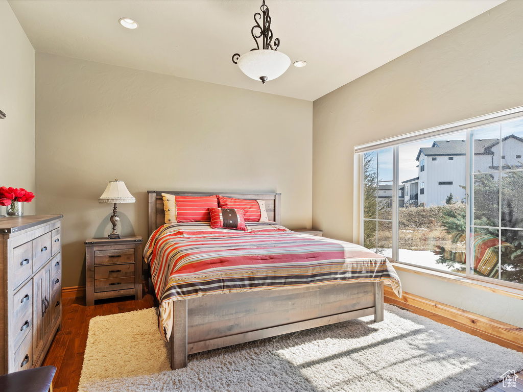 Bedroom featuring recessed lighting and dark wood-style floors