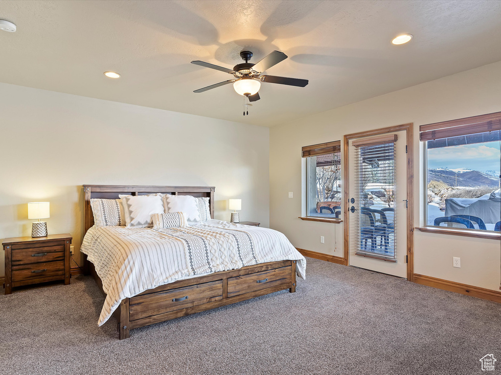 Bedroom with recessed lighting, baseboards, access to exterior, and carpet flooring