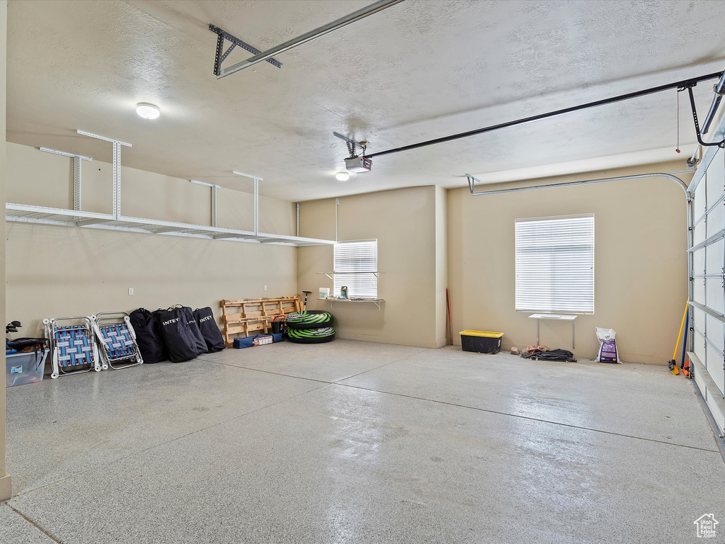 Garage featuring a garage door opener
