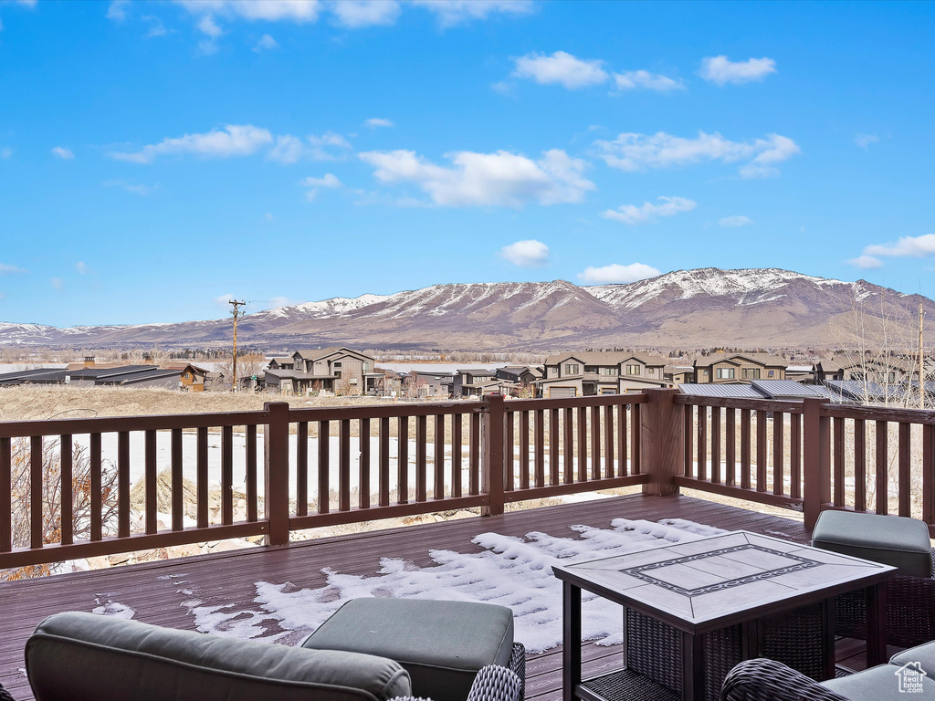 Deck with a mountain view and a residential view