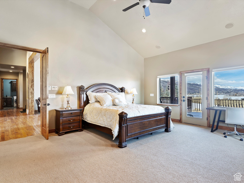 Bedroom with high vaulted ceiling, recessed lighting, ceiling fan, light carpet, and access to outside