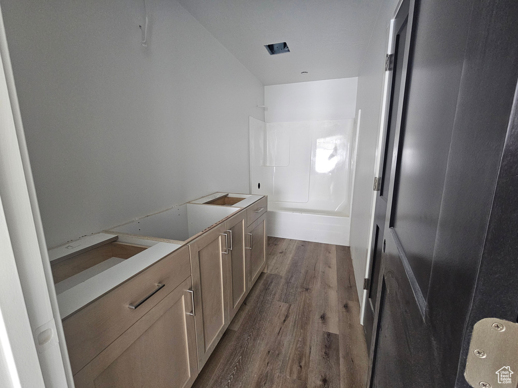 Interior space with visible vents, dark wood-type flooring, and light countertops