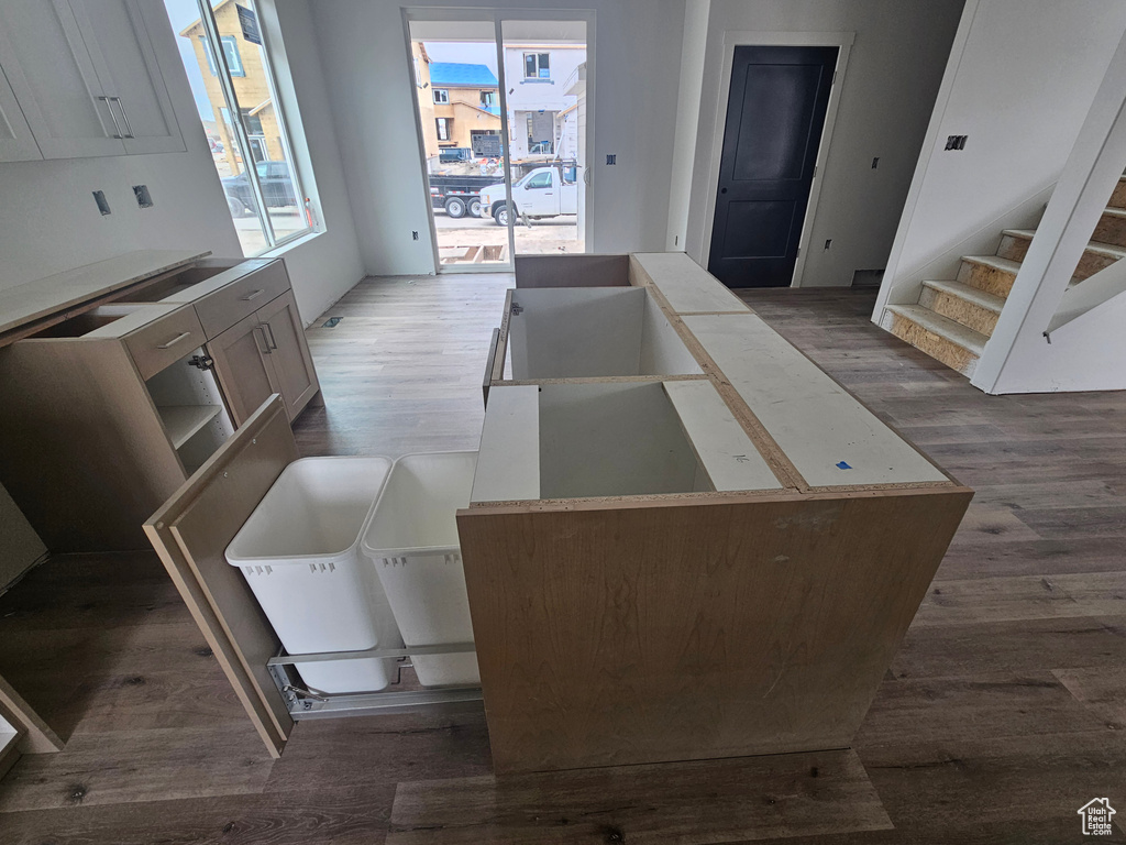 Kitchen with dark wood-type flooring