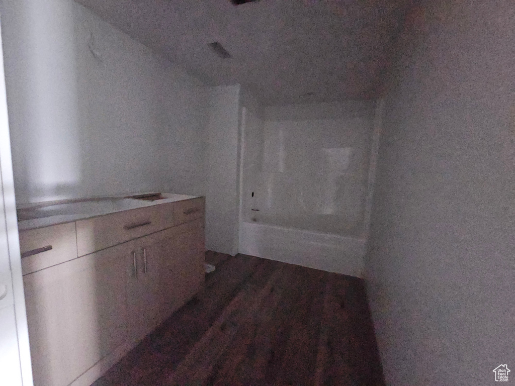 Corridor with wood finished floors