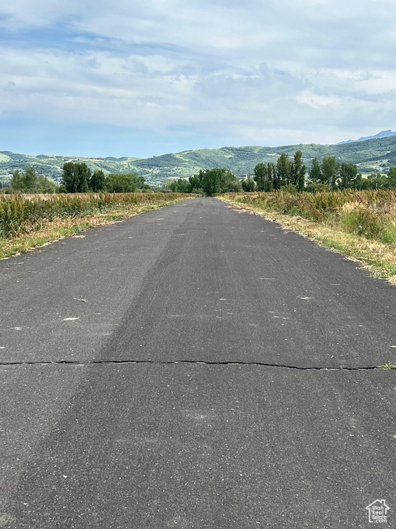 View of asphalt road featuring a mountain view