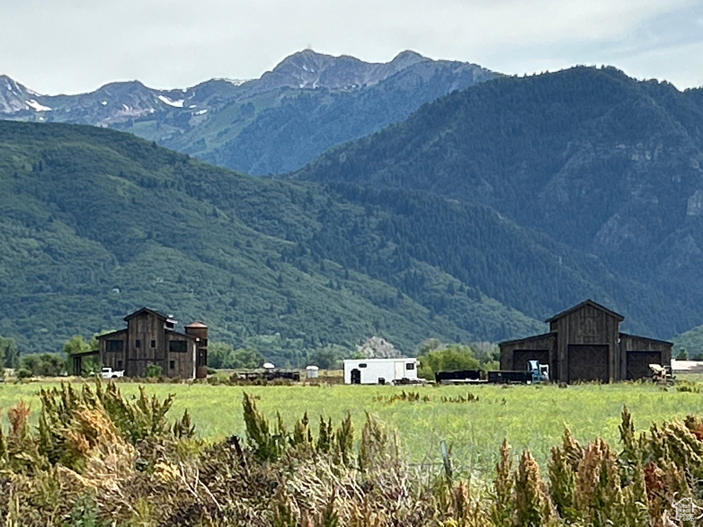 View of mountain backdrop featuring rural landscape