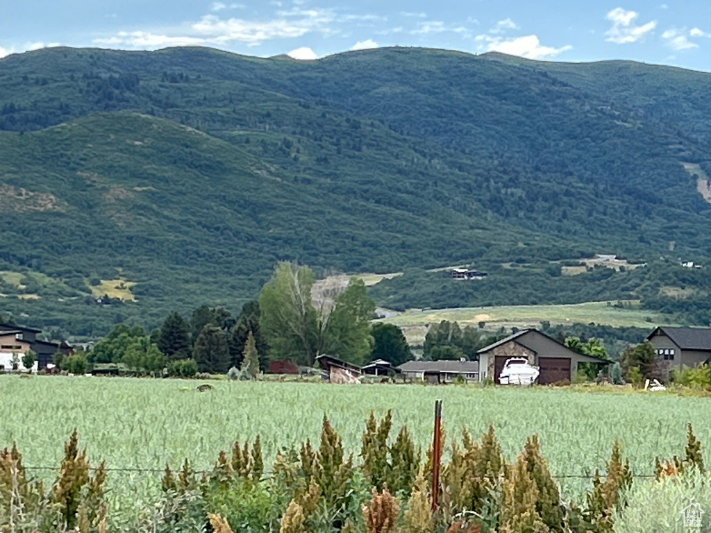 View of mountain backdrop featuring rural landscape