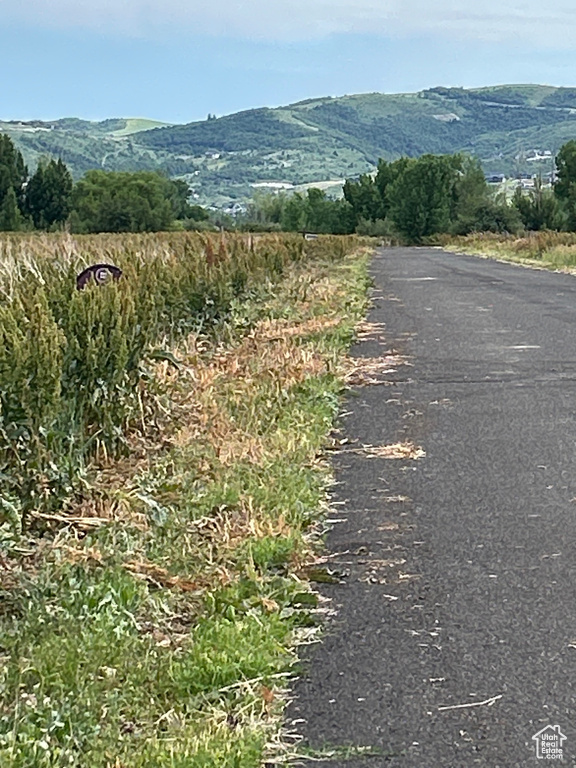 View of mountain backdrop featuring rural landscape
