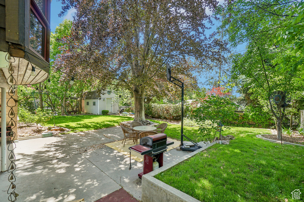View of patio / terrace featuring an outbuilding and area for grilling