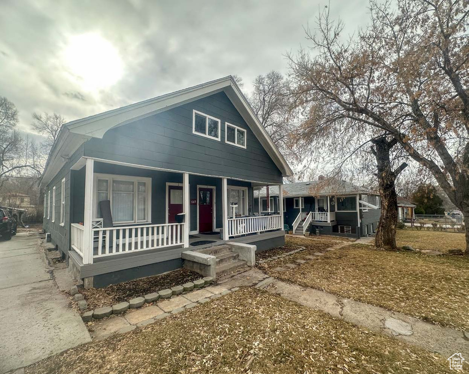 Bungalow-style house with covered porch