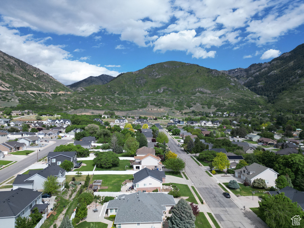 Aerial view of residential area featuring a mountainous background