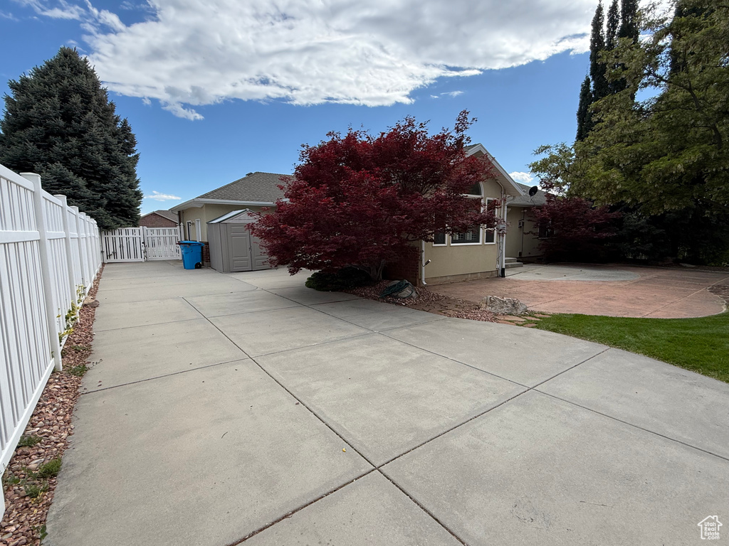View of home\\\\\\\'s exterior with a patio and concrete driveway