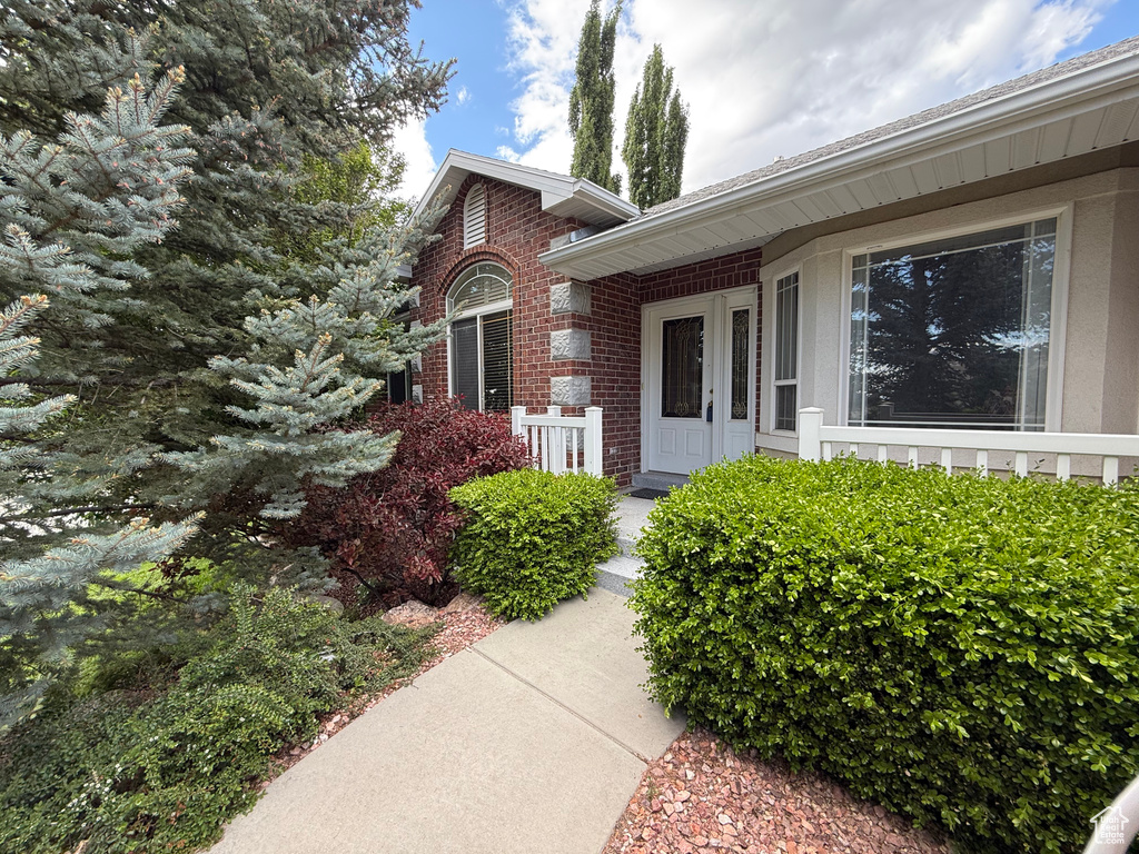 Property entrance with brick siding