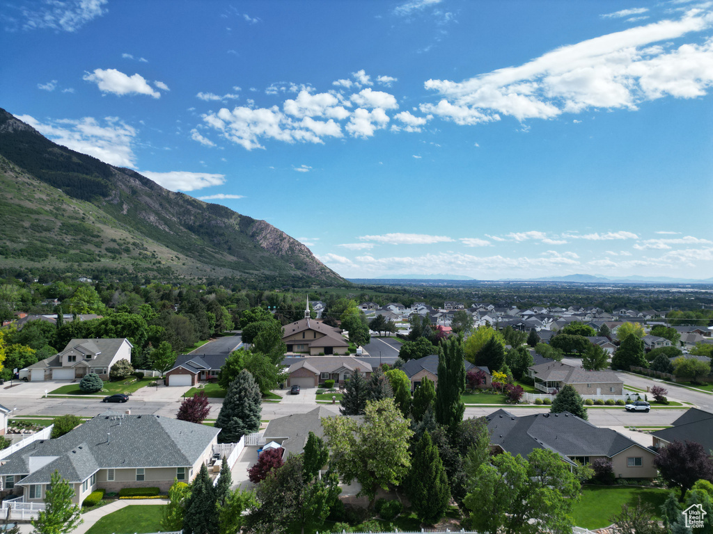 Aerial view of residential area with a mountainous background