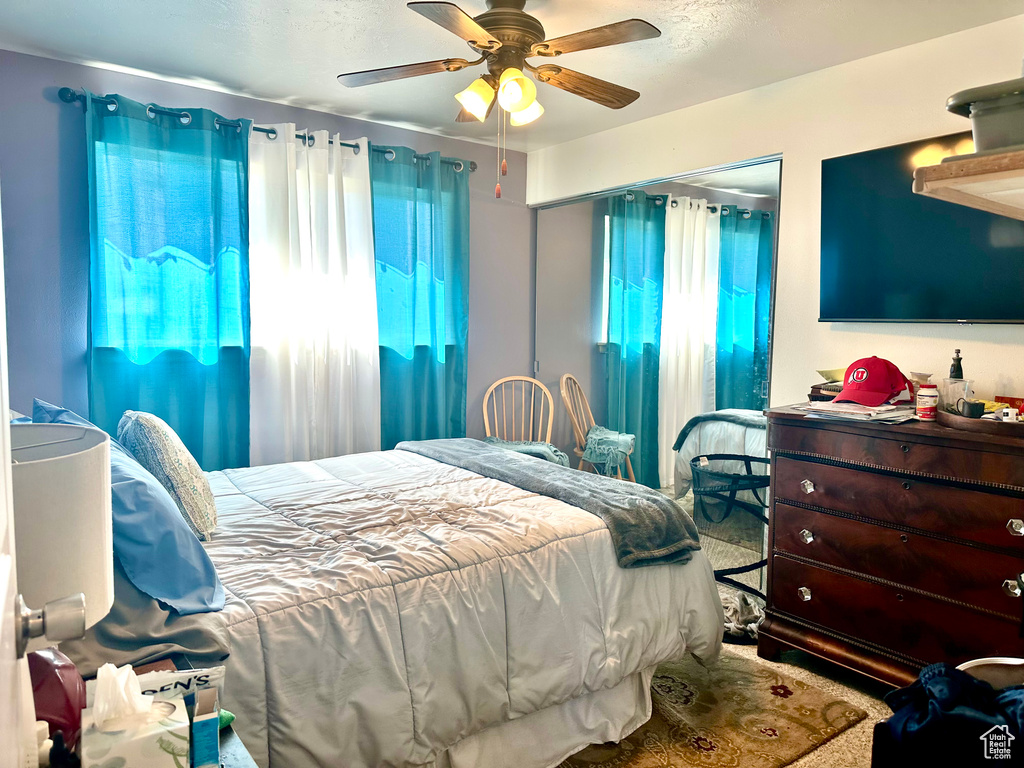 Bedroom featuring ceiling fan