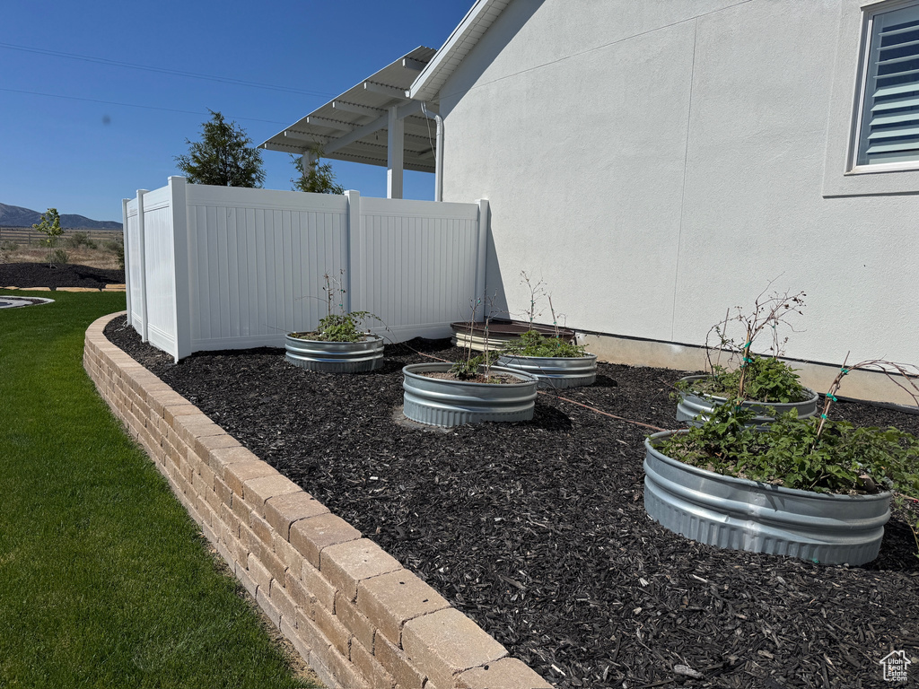 View of yard featuring a mountain view and a garden