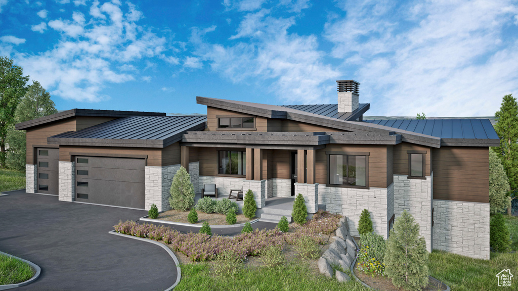 Modern home with a standing seam roof, metal roof, and stone siding
