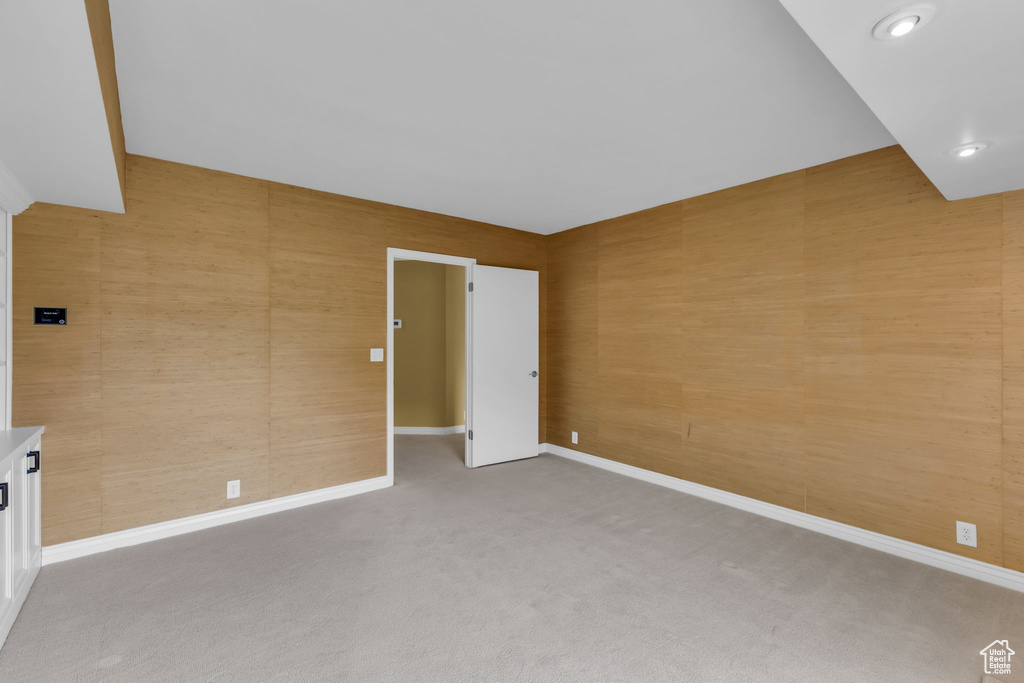 Carpeted spare room with baseboards