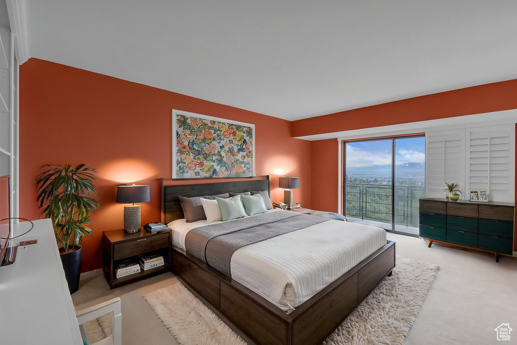 Carpeted bedroom with access to outside
