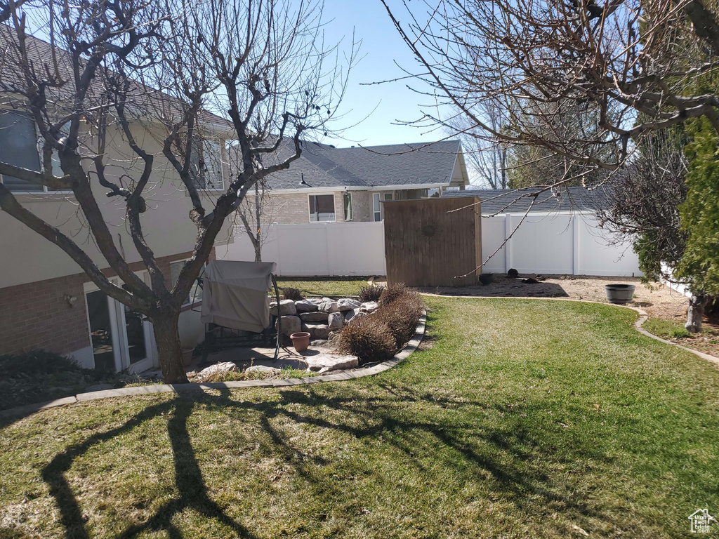 View of yard featuring a patio area and a fenced backyard