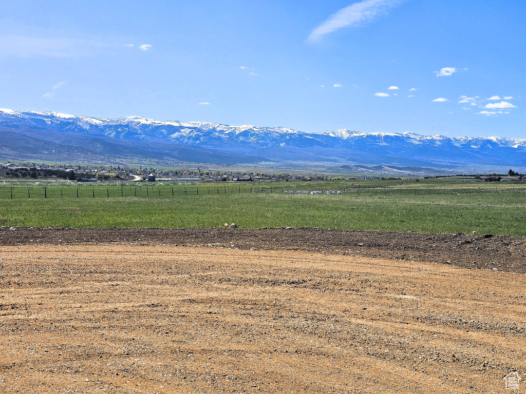 View of mountain background featuring rural landscape