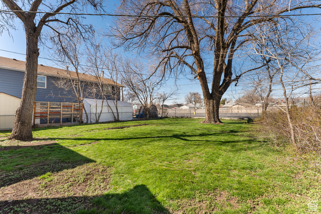 View of yard with fence
