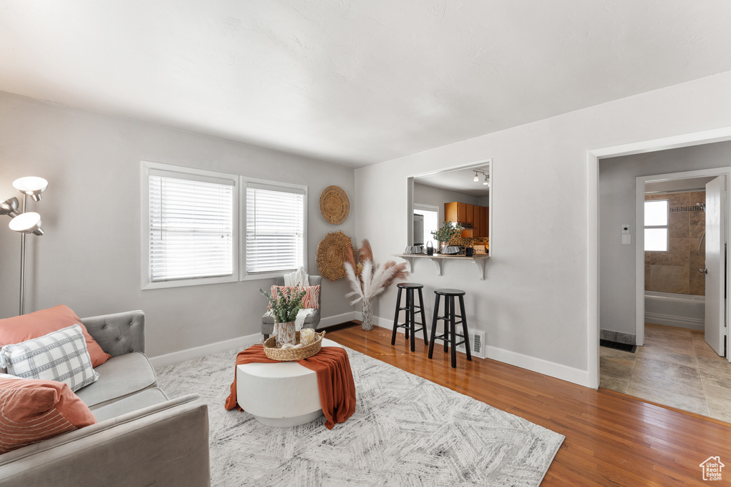 Living room featuring baseboards and wood finished floors