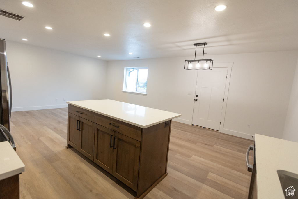 Kitchen featuring visible vents, recessed lighting, light countertops, and light wood-type flooring