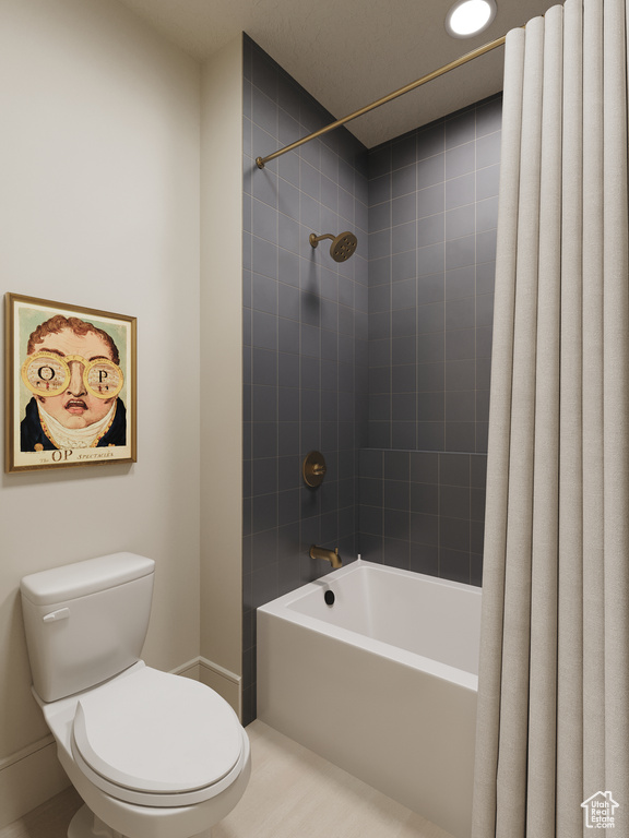 Bathroom featuring toilet and shower / tub combo