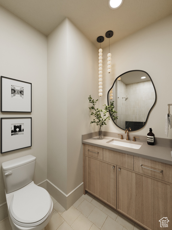 Full bath featuring vanity, tile patterned floors, and a tile shower