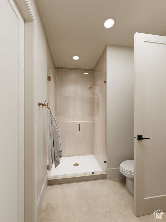 Bathroom with a shower stall and recessed lighting
