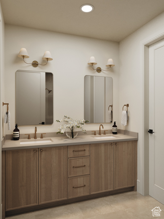 Bathroom with double vanity and recessed lighting