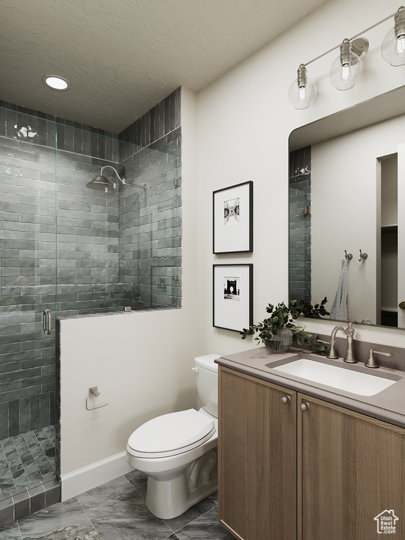 Full bath with vanity, a shower stall, marble finish flooring, recessed lighting, and a textured ceiling