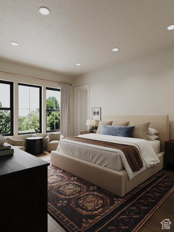 Bedroom featuring wood finished floors and recessed lighting