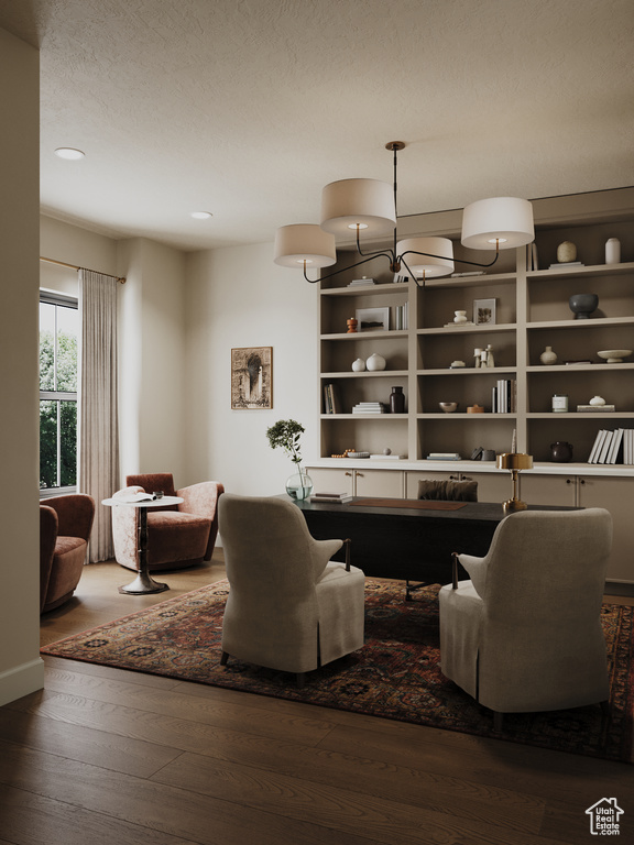 Living area with hardwood / wood-style floors and recessed lighting
